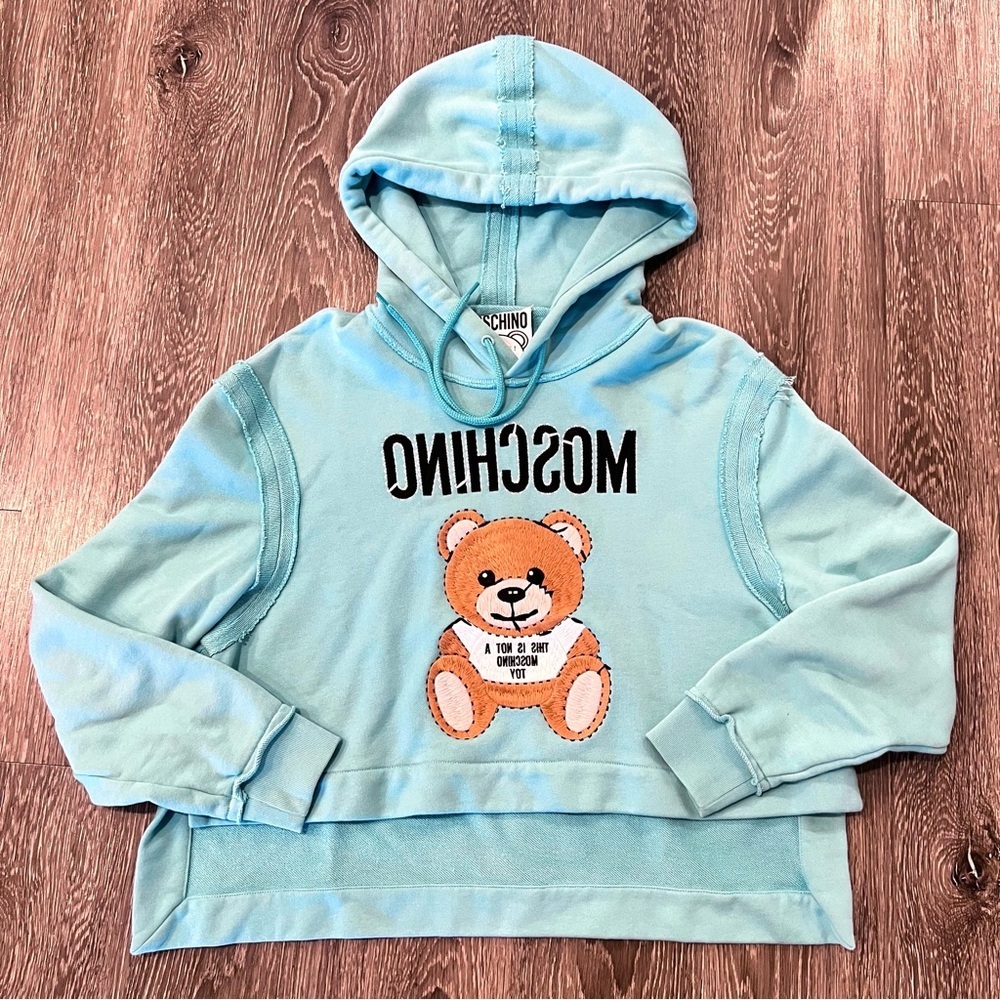 Moschino Embroidered Teddy Bear Cropped Hoodie. Light blue. Size 6. Fits a S & M
